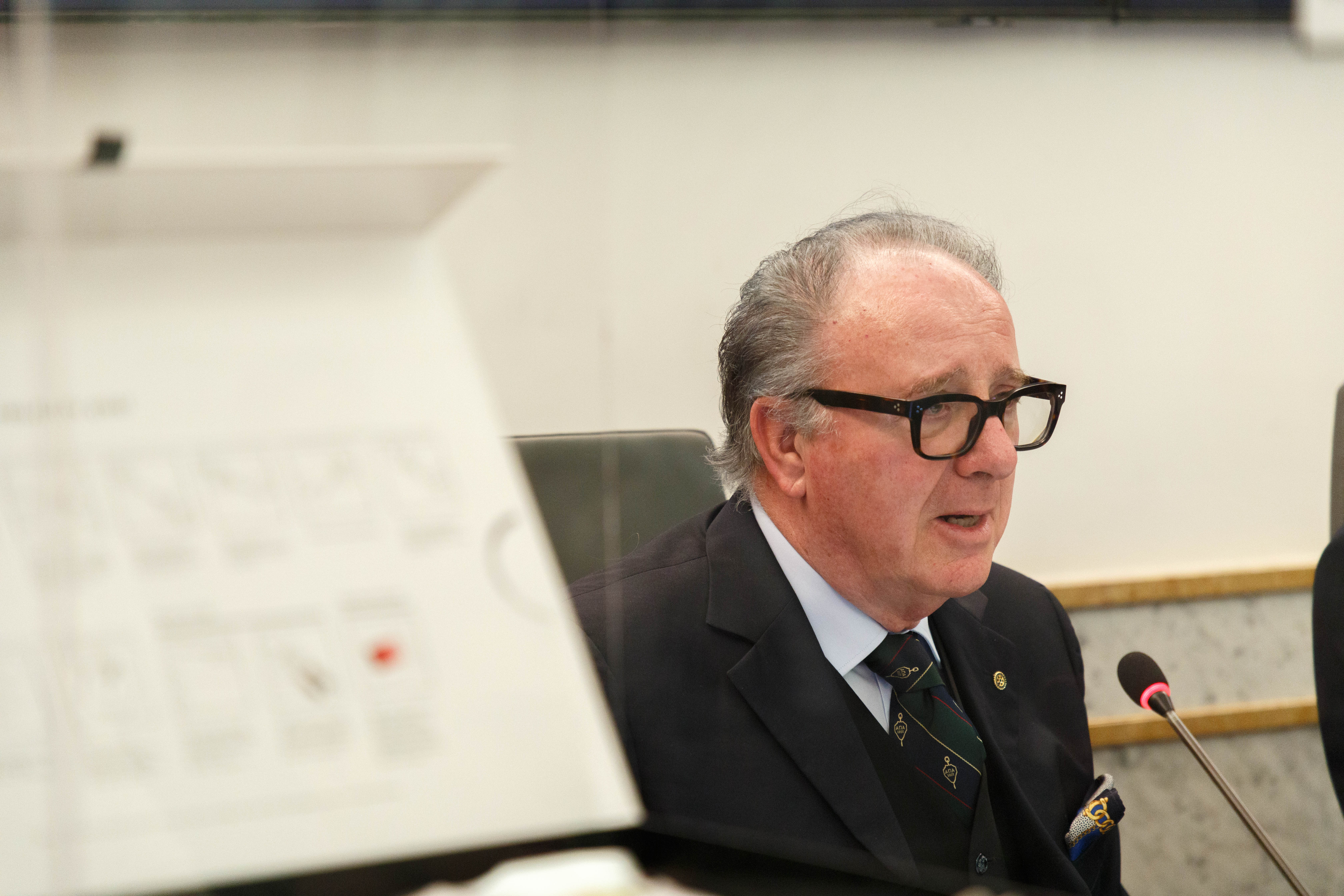 Torello Lotti is speaking into the microphone at the educational seminar